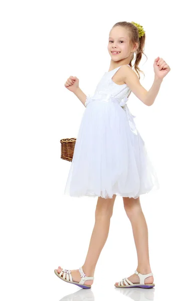 Beautiful little girl With a basket in her hand. — Stock Photo, Image