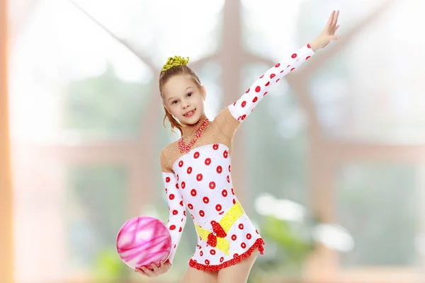 Gymnast does exercises with a ball — Stock Photo, Image