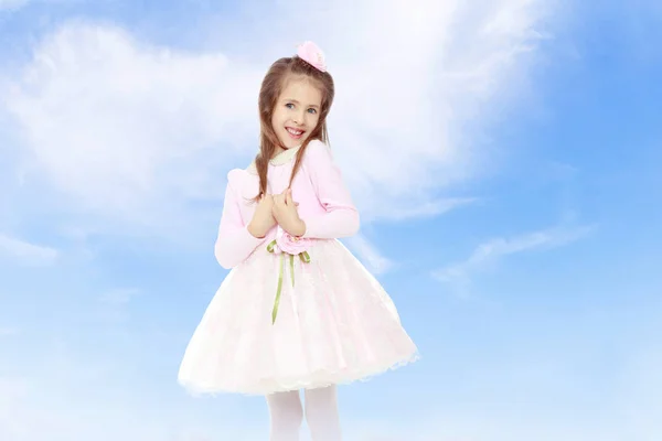 Elegante niña en un vestido rosa . —  Fotos de Stock