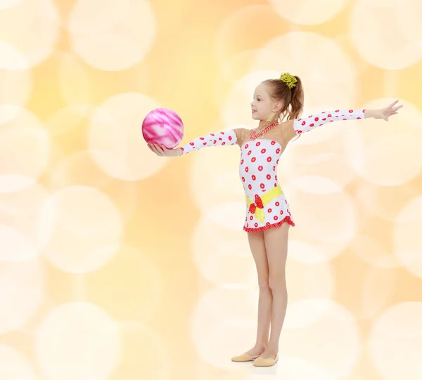 Gymnast does exercises with a ball — Stock Photo, Image