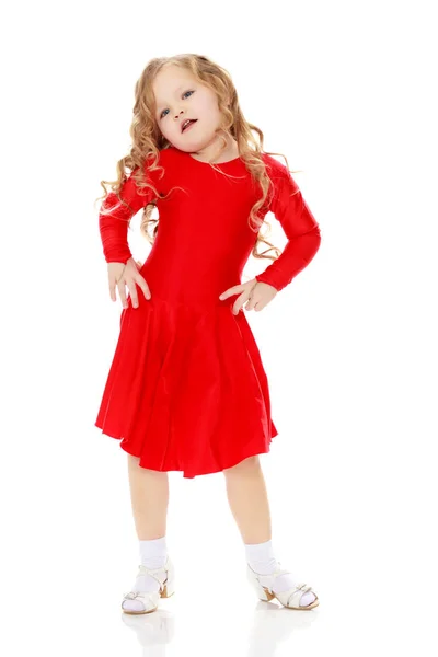 Girl dancing in a bright red dress. — Stock Photo, Image