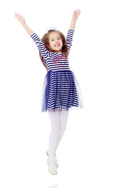 Little girl in a striped dress. — Stock Photo, Image