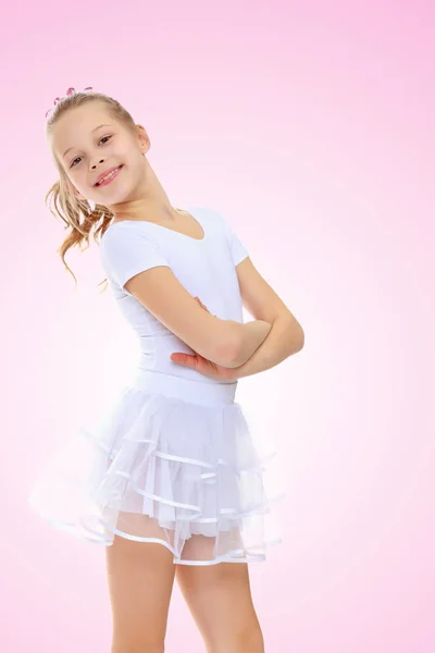 Fille gymnaste dans un survêtement blanc . — Photo