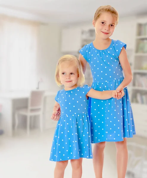 Sisters in blue dresses — Stock Photo, Image