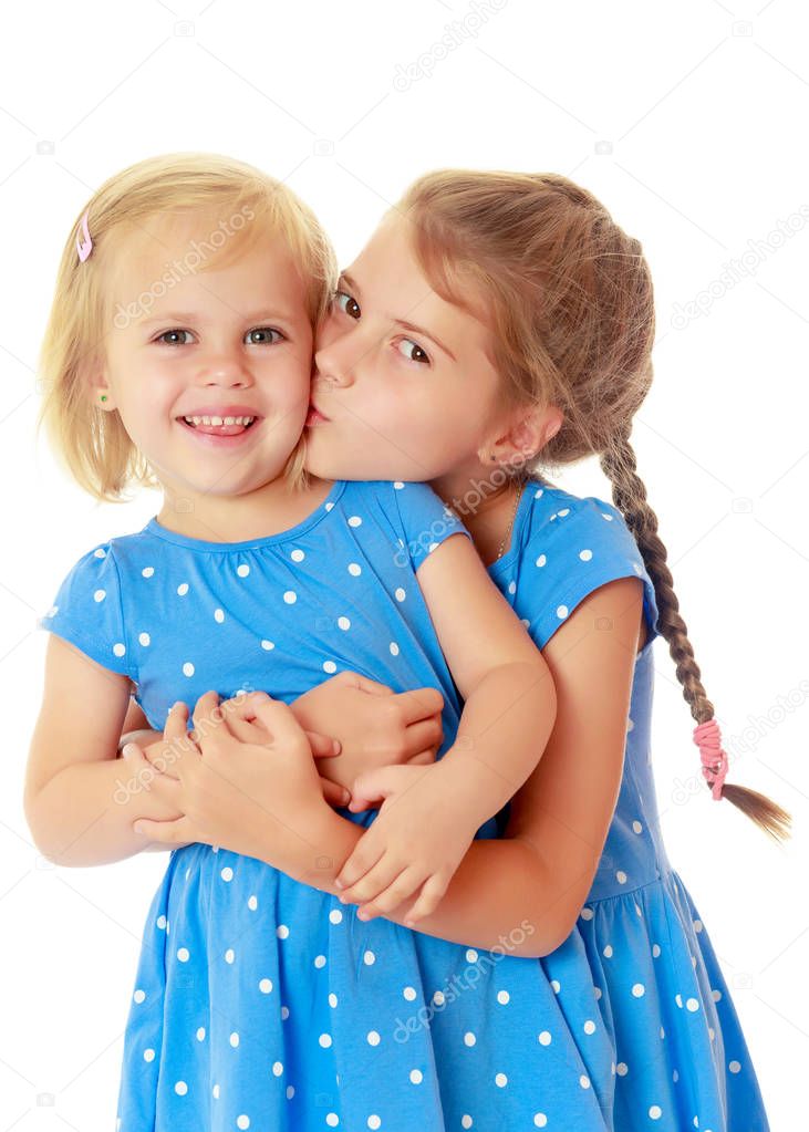 Little sisters kiss
