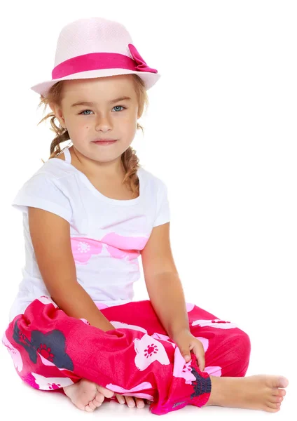 Tanned little girl in a hat — Stock Photo, Image