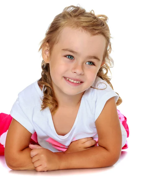 Beautiful little girl lying on the floor, and what youre dreami — Stock Photo, Image