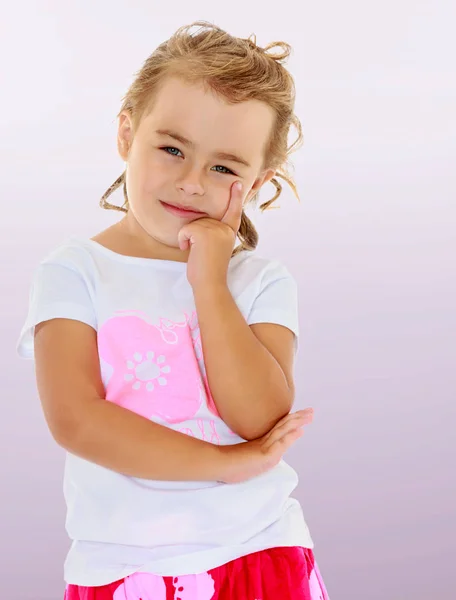 Beautiful little girl dreaming about something. — Stock Photo, Image