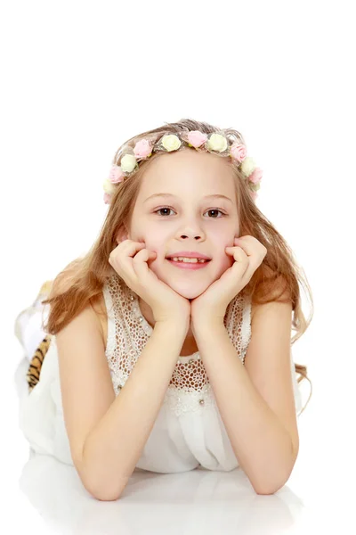 Girl lying on the floor hugging his head. — Stock Photo, Image