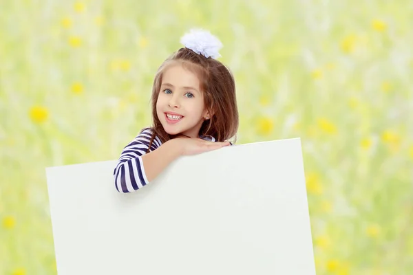 Little girl in a striped dress. — Stock Photo, Image