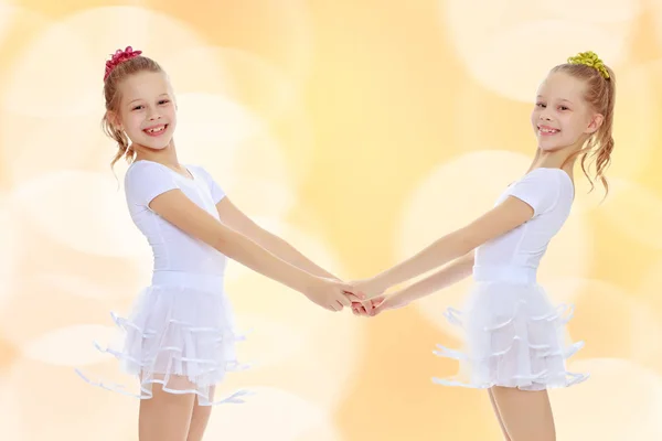 Cute girls holding hands — Stock Photo, Image