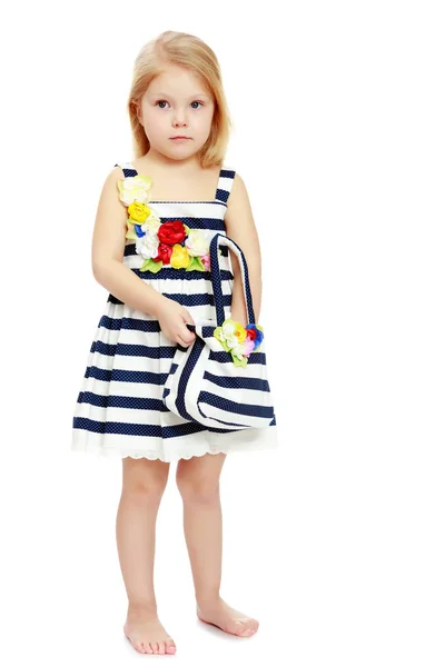 Little girl in a striped dress. — Stock Photo, Image