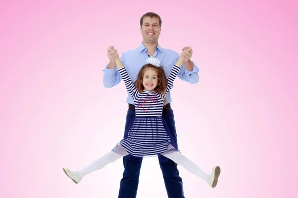 Dad holding daughters hands. — Stock Photo, Image