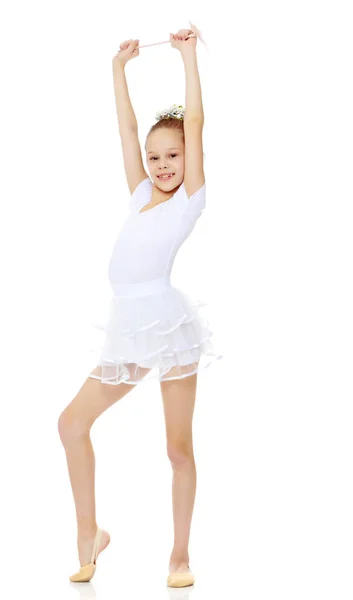 Dziewczynka gimnastyczka z różdżką w ręku. — Zdjęcie stockowe