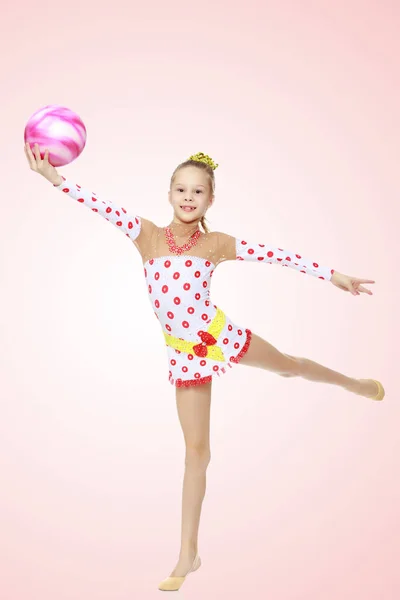 Gymnast does exercises with a ball — Stock Photo, Image