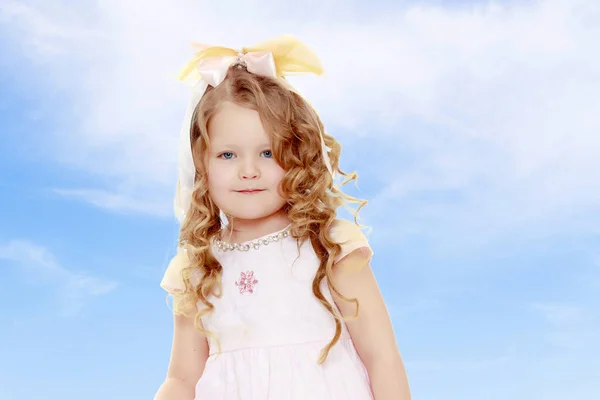 Little girl with curly hair.