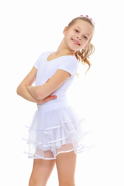 Girl gymnast in a white tracksuit. — Stock Photo, Image