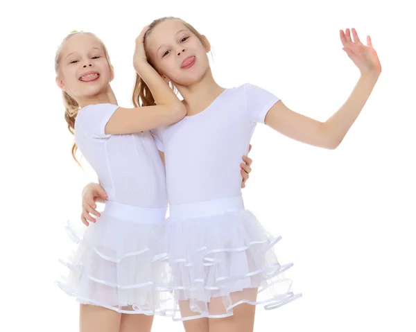 2 girls gymnast in white suits. — Stock Photo, Image