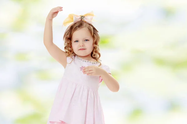 Girl shows the doll. — Stock Photo, Image