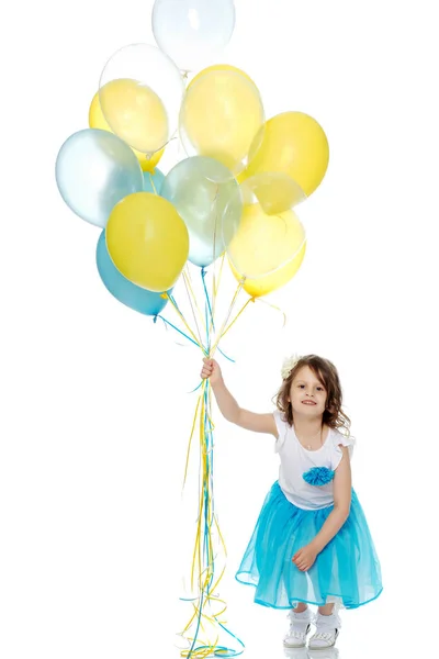 Little girl with multicolored balloons. — Stock Photo, Image