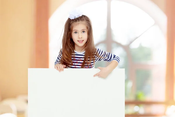 Little girl in a striped dress. — Stock Photo, Image