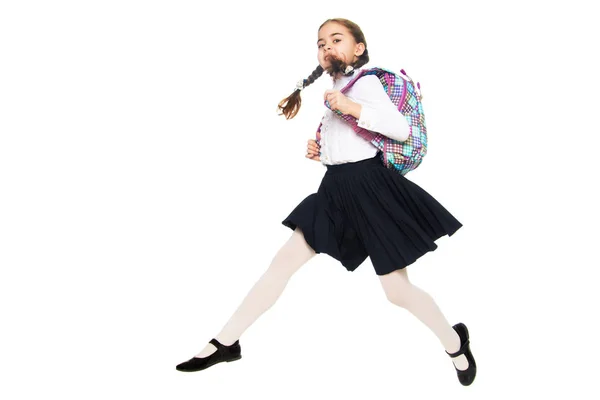 Een schoolmeisje meisje is te springen over obstakels. — Stockfoto