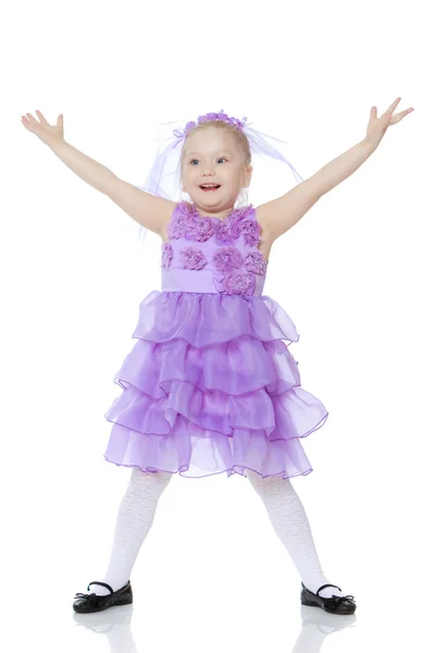 Little girl in purple dress. Stock Photo