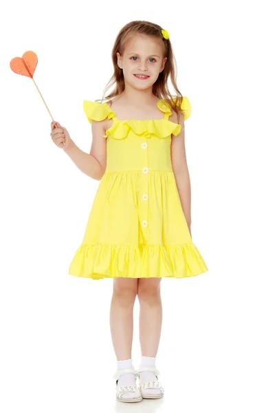 Little girl with a candy on a stick — Stock Photo, Image