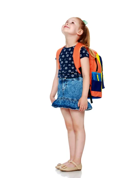 Little girl schoolgirl with flowers — Stock Photo, Image