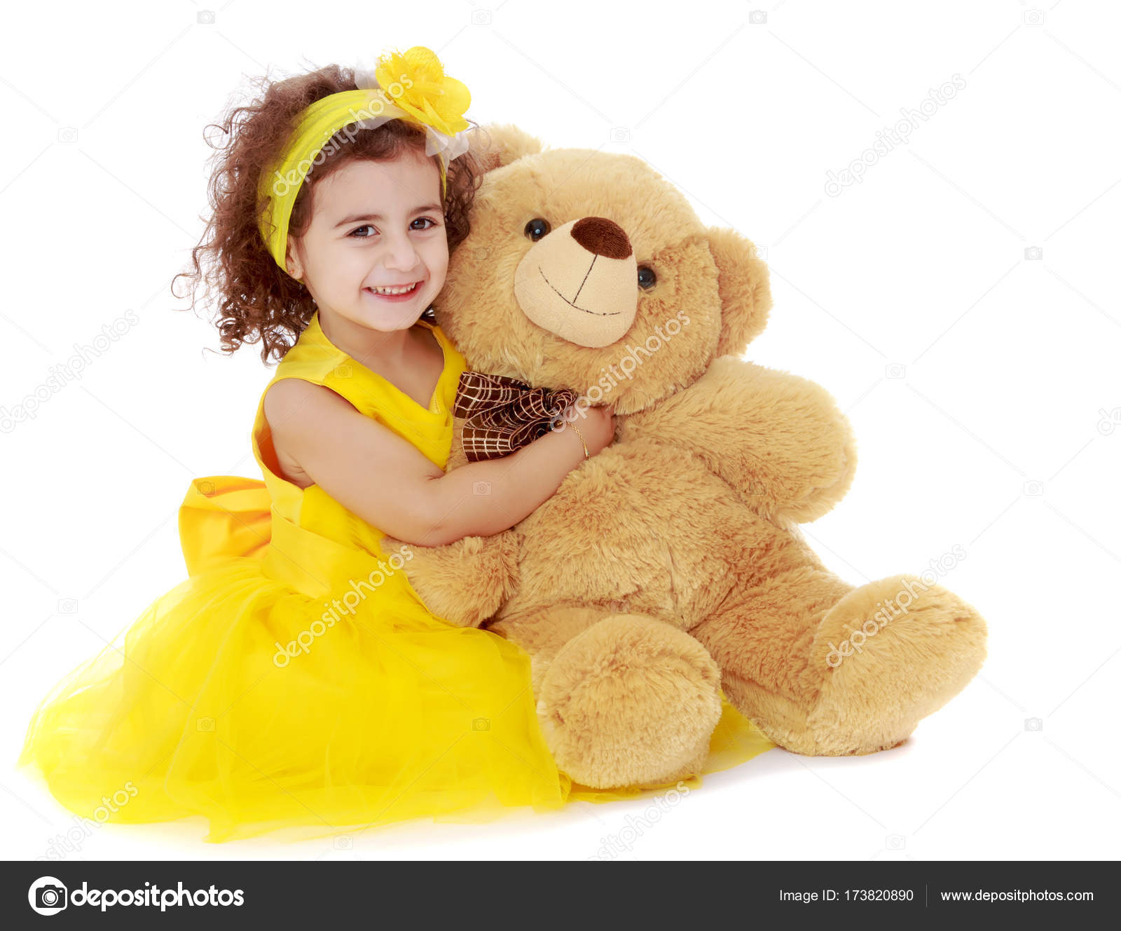 girl hugging teddy bear