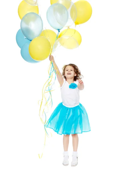 Meisje met veelkleurige ballonnen. — Stockfoto