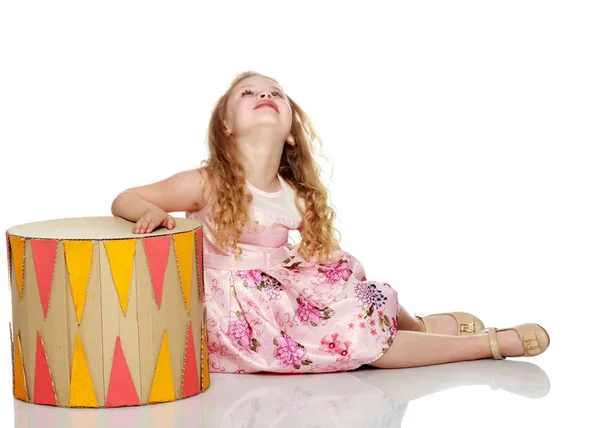 Little girl is sitting on the floor. — Stock Photo, Image