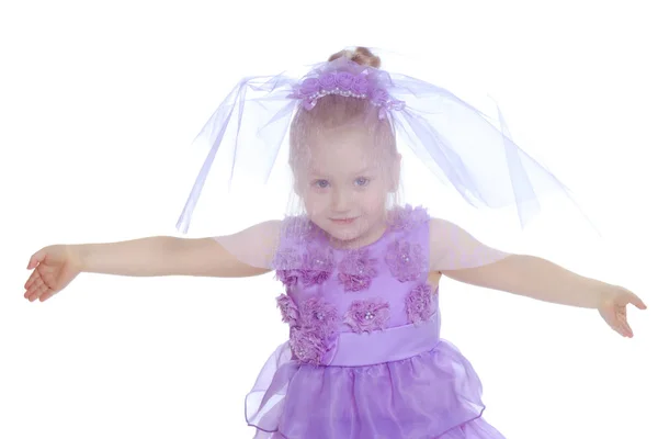 Little girl in purple dress. — Stock Photo, Image