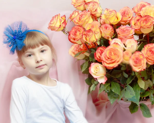 Beautiful little blonde girl with long hair and a short bangs on — Stock Photo, Image