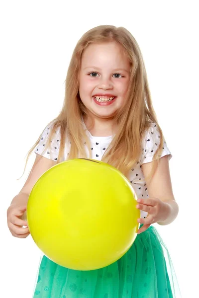 Little girl is playing with a ball — Stock Photo, Image