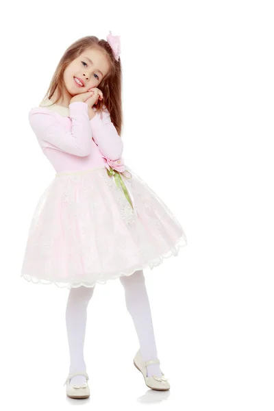 Elegante bambina in un abito rosa . — Foto Stock