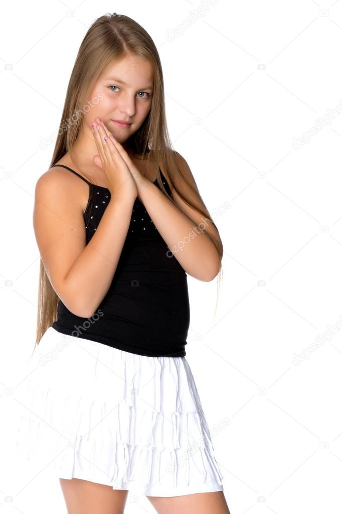 A teenage girl in a short white skirt and a black T-shirt.