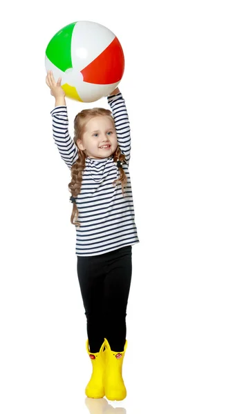 Little girl is playing with a ball — Stock Photo, Image