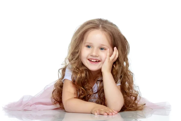 Little girl lies on the floor — Stock Photo, Image