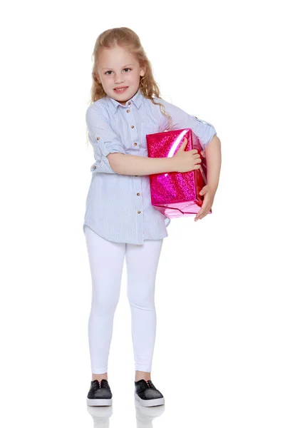 Little girl with a gift — Stock Photo, Image