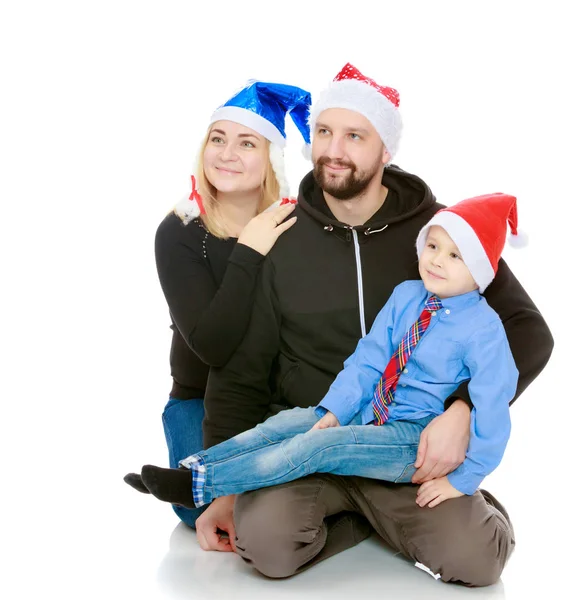 Lykkelig familie ved juletræet - Stock-foto