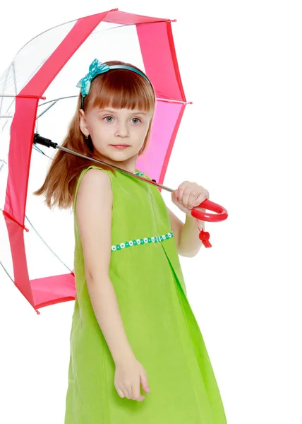 The girl closed from the sun and rain under a red umbrella. — Stock Photo, Image