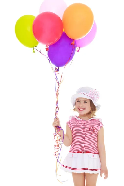 Little girl is playing with a balloon — Stock Photo, Image