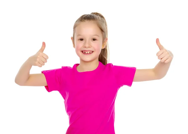 Klein meisje houdt haar duim omhoog — Stockfoto