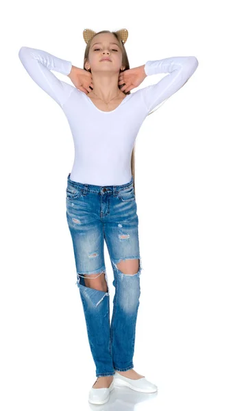 Beautiful teen girl in jeans with holes. — Stock Photo, Image