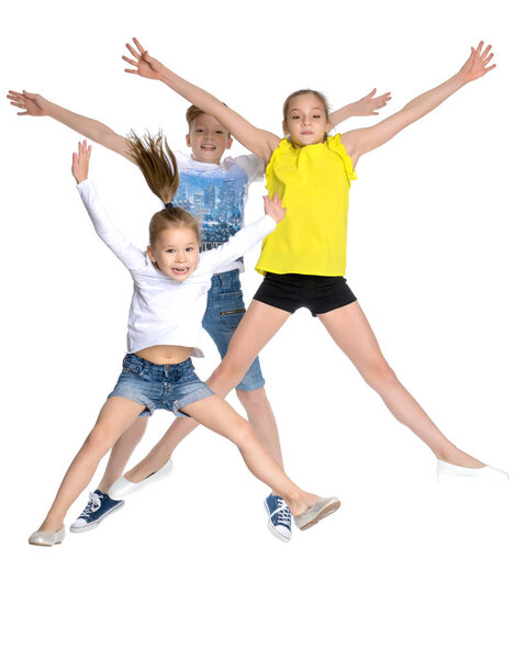 A group of children jumping and waving.