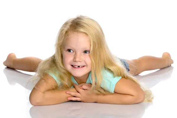 小さな女の子が床にあります。 ロイヤリティフリーのストック写真