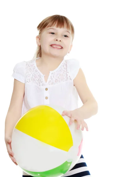 Little girl is playing with a ball — Stock Photo, Image