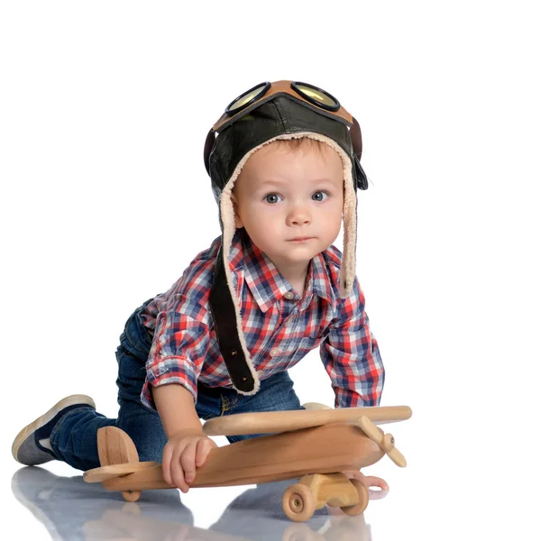 Little boy with a wooden plane. — Stock Photo, Image