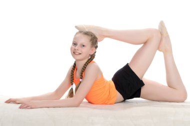 Jimnastikçi akrobatik bir öğe yere gerçekleştirir..